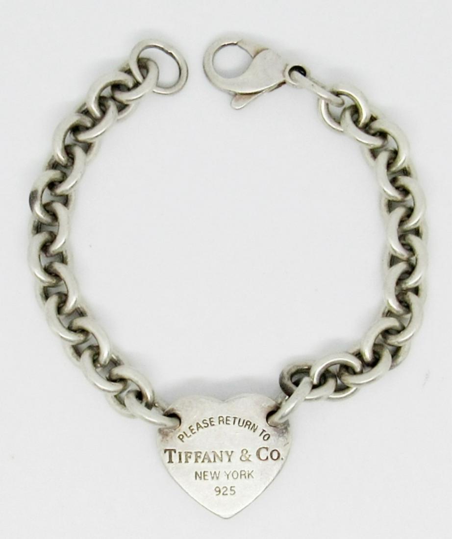 Tiffany & Co Heart Chain Bracelet: 17.4dwt, 7 1/2in, Lobster clasp, "PLEASE RETURN TO TIFFANY & CO NEW YORK 925" on the front of the heart, has tiffany & co 925 also stamped on the back