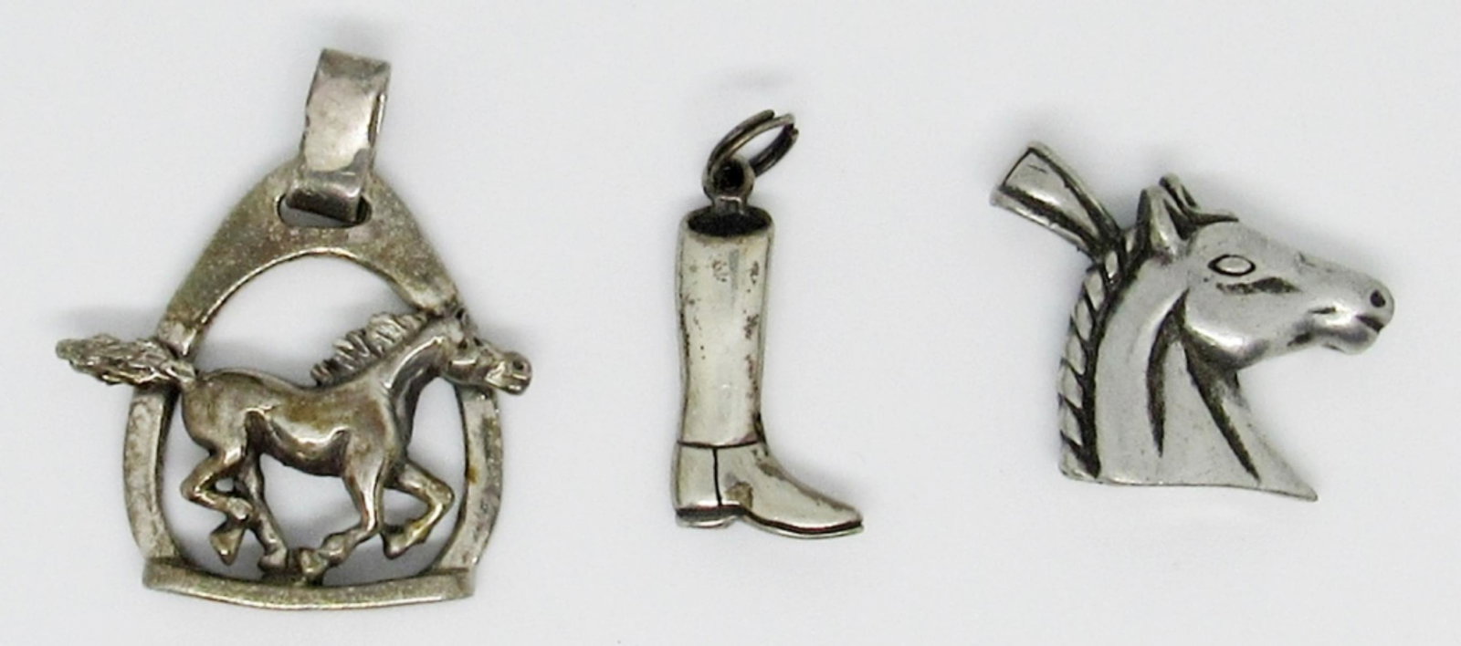 (3) Horse Theme Pendants/Charm: 11dwt, charm-cowboy boot, 2- horse pendants all stamped with 925 , all three about 3in in size