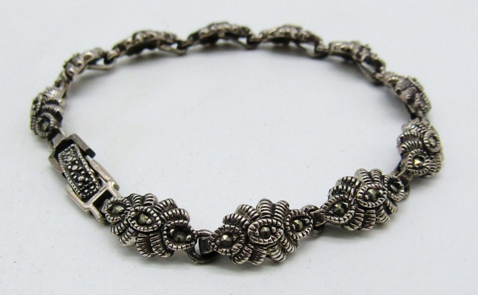 Vintage Sterling Bracelet w/ Marcasite stones: 13dwt, 7in, stunning design with marcasite little stones all along the bracelet, stamped Thai and 925 inside open box clasp