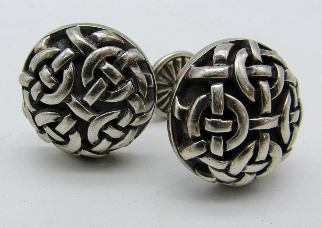 Sterling Button Cufflinks: 17.4dwt,stamped 925 on the bar and also brand cant be read, has a woven design on front and a cresent moon and star on the smaller part, JB Kieselsten Cord