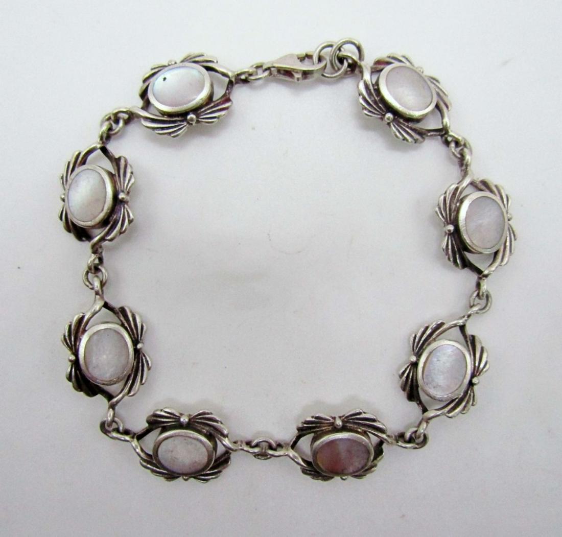 Mother of Pearl Inlay Bracelete: 10dwt 7 1/2in mother of pearl inlay,stamped 925 THAI
