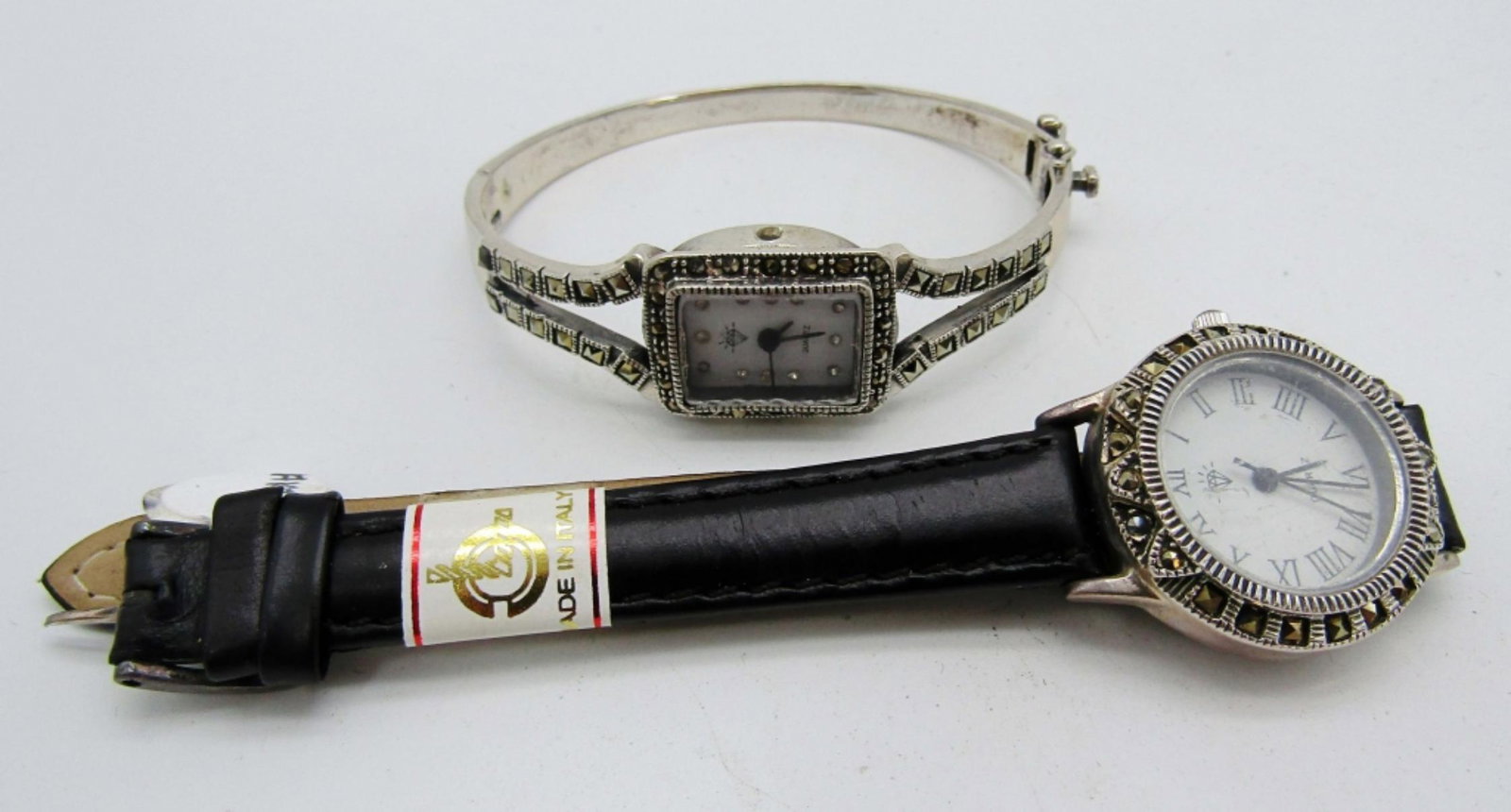 (2) MARCASITE & STERLING WATCHES: (1) HINDGED missing BOW (1) BLACK LEATHER BAND - NEEDS NEW BATTERY