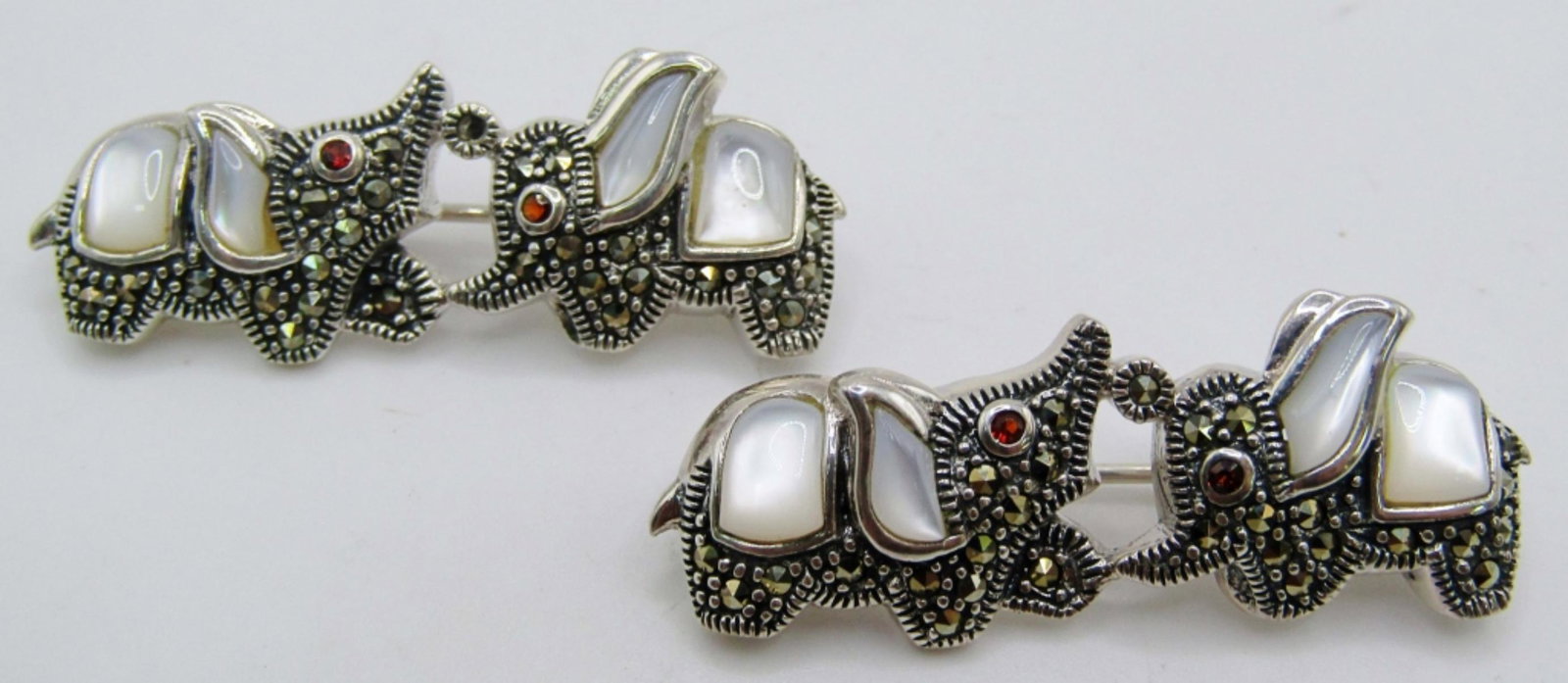 (2)Mother Of Pearl & Marcasite 925 Elephant Pins: 11dwt, 2in, stamped 925, ears are mother of pearl in lay, marcasite make the body with red stones for the eyes