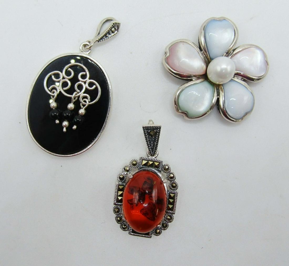 3-STERLING FASHION PENDANTS (2)MARCASITE: (1)FLOWER WITH LUCITE AND PEARL CENTER-TOTAL 13 DWT