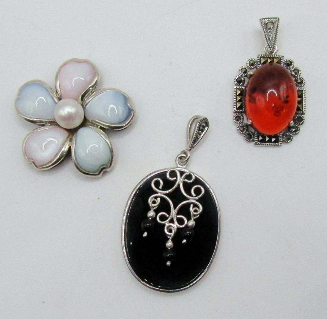 3-STERLING FASHION PENDANTSl (2)MARCASITE: (1)FLOWER WITH LUCITE AND PEARL CENTER-TOTAL 13 DWT