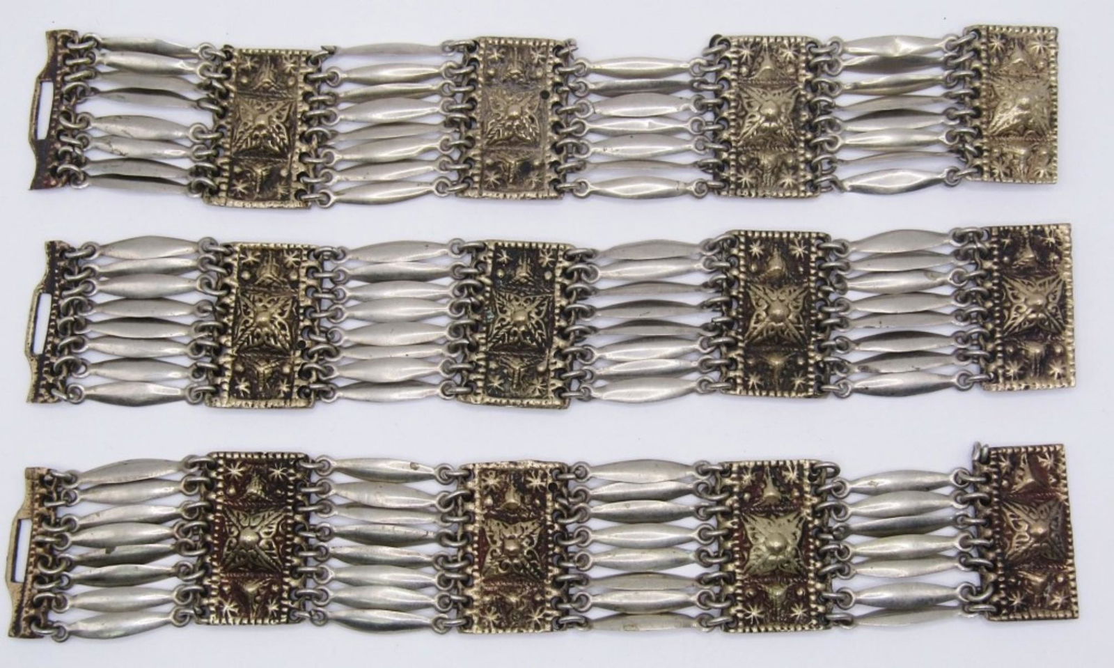 LOT OF 3 VINTAGE AZTEC STYLE CHAIN BRACELETS: LOT OF 3 MATCHING VINTAGE AZTEC STYLE WIDE CHAIN BRACELETS, STAMPED SILVER MEXICO, 1 HAS BROKEN CLASP & MISSING A LINK, 1 MISSING A LINK.