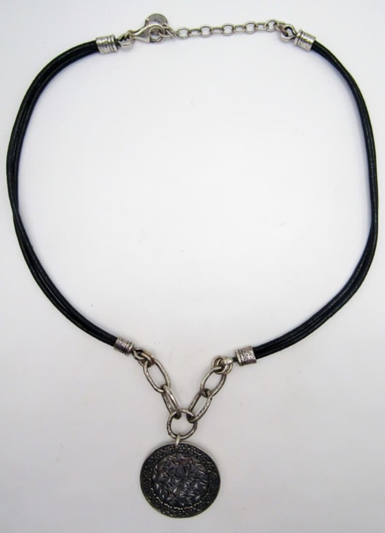 Sterling Pendant With a Cord Chain Choker: 12dwt, marked 925 and Israel on pendent , 925 marked on cord necklace