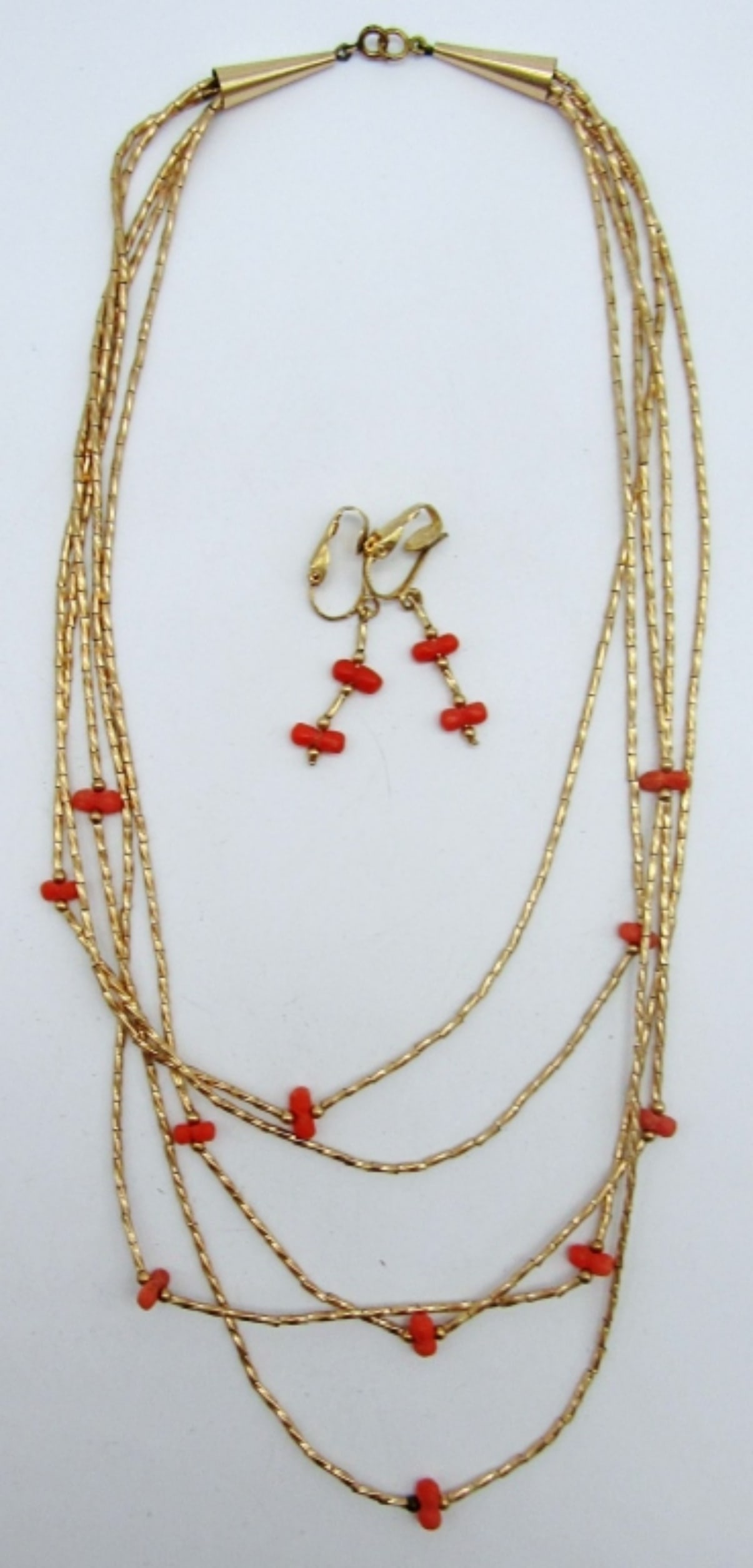 CORAL AND GOLD TONE BIB NECKLACE AND EARRING SET: LAYERED NECKLACE 16 IN LENGTH, DANGLED CLIP ON EARRINGS TO MATCH