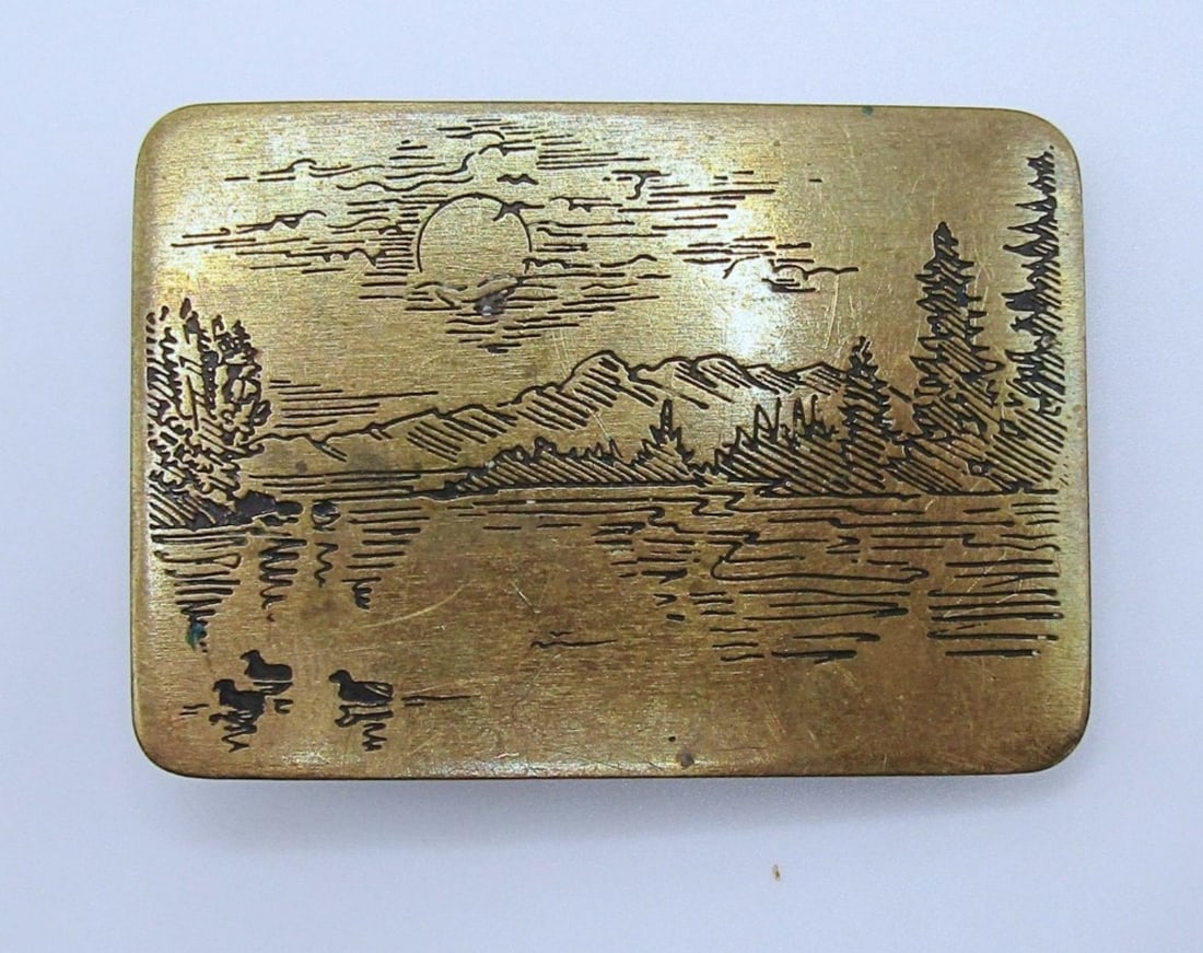 GOLD TONE MOUNTIAN SCENE BELT BUCKLE: NAP BRAND MADE IN 1984, OVER 2IN IN LENGTH