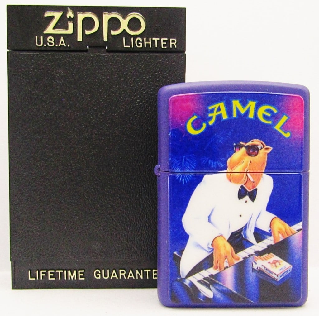 1997 Sealed Joe Camel Piano Zippo Lighter NEW: Purple Lighter, White Tux; New In Case.