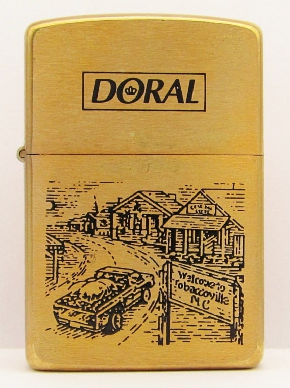 1996 Doral Brass Sealed Zippo Lighter: "Welcome To Tobaccoville NC" Sealed Zippo Lighter.