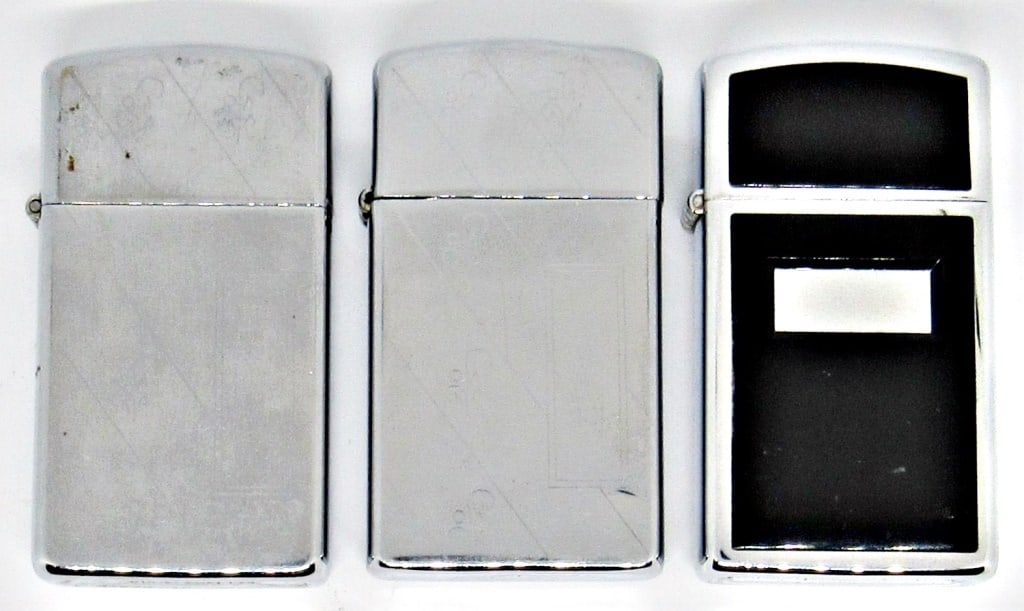 (3) VINTAGE SILVER TONE ZIPPO LIGHTERS: (2) 1985 SLIM DIAGONAL PATTERN, STRIPED PATTERN BACK; 1991 CHROME AND BLACK ONYX; ALL IN USED CONDITION