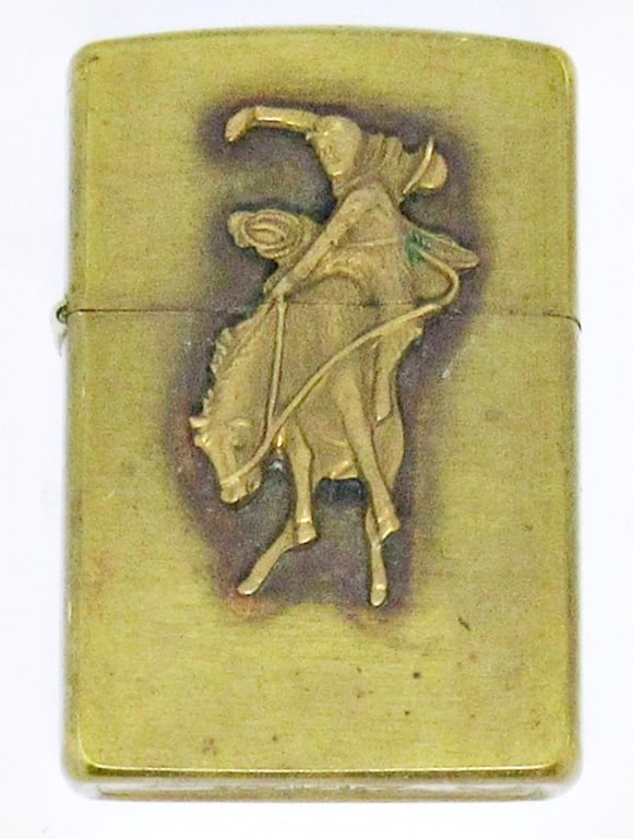1995 MARLBORO ZIPPO LIGHTER COWBOY: 1995 BRASS MARLBORO ZIPPO LIGHTER, COWBOY HORSE RAISED EMBLEM; USED CONDITION