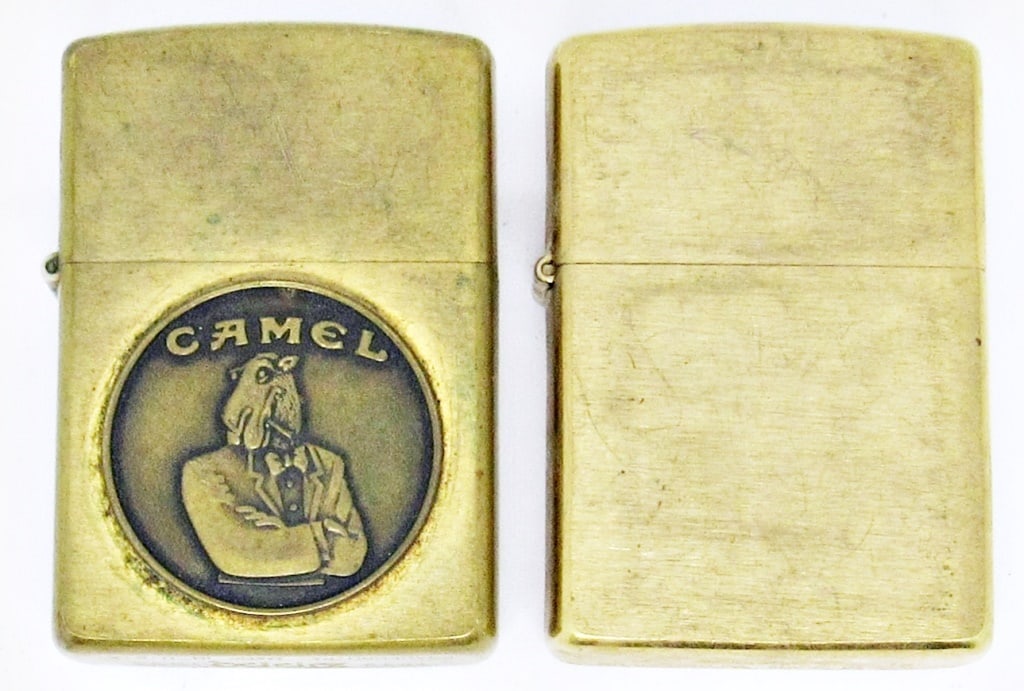 (2) BRASS ZIPPO LIGHTERS, CAMEL EMBLEM: 1992 BRASS ZIPPO RAISED CAMEL EMBLEM; 2018 BRUSHED BRASS VINTAGE LOOK; USED CONDITION