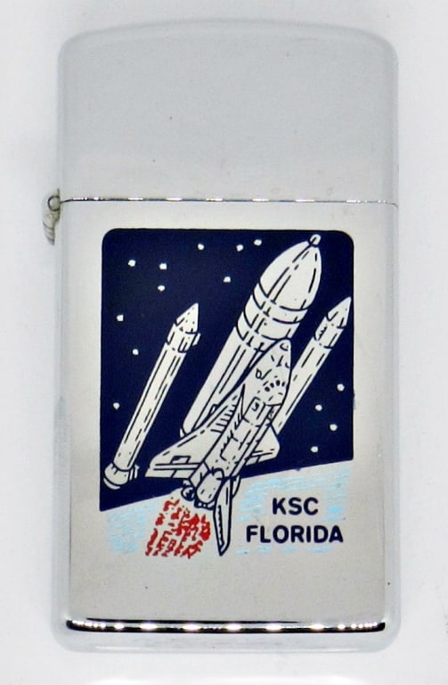 1979 SILVER ZIPPO LIGHTER SPACE SHUTTLE: 1979 SILVER TONE ZIPPO LIGHTER; KSC FLORIDA SPACE SHUTTLE; USED CONDITION