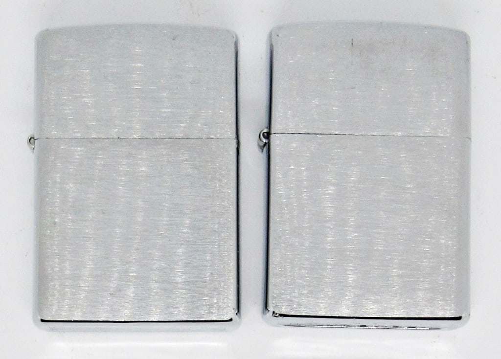 (2) 2005 & 2006 BRUSHED CHROME ZIPPOS: 2005 & 2006 BRUSHED CHROME, PLAIN SILVER TONE ZIPPO LIGHTERS; USED CONDITION