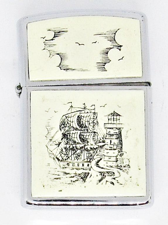 VINTAGE SLIM ZIPPO LIGHTER SILVER IVORY: 1990 SLIM STYLE ZIPPO LIGHTER; IVORY SCRIMSHAW PIRATE SHIP & TENDER BOAT; USED CONDITION