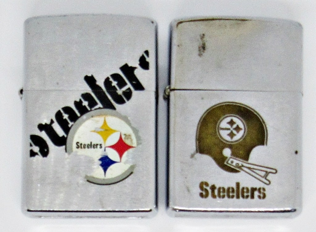 1973 & 2000 ZIPPO LIGHTERS STEELERS EMBLEM: 1973 & 2000 SILVER TONE ZIPPO LIGHTERS WITH STEELERS EMBLEMS; USED CONDITION