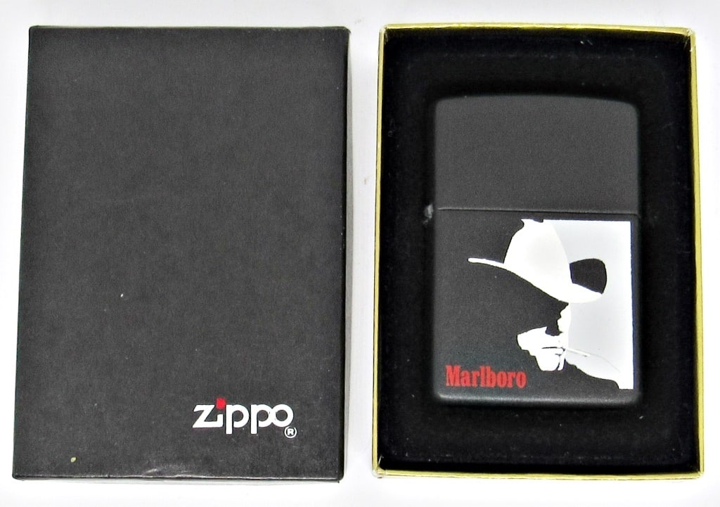 BLACK MATTE ZIPPO MARLBORO MAN EMBLEM: BLACK MATTE VINTAGE ZIPPO LIGHTER WITH MARLBORO MAN EMBLEM; USED CONDITION; IN ORIGINAL BOX