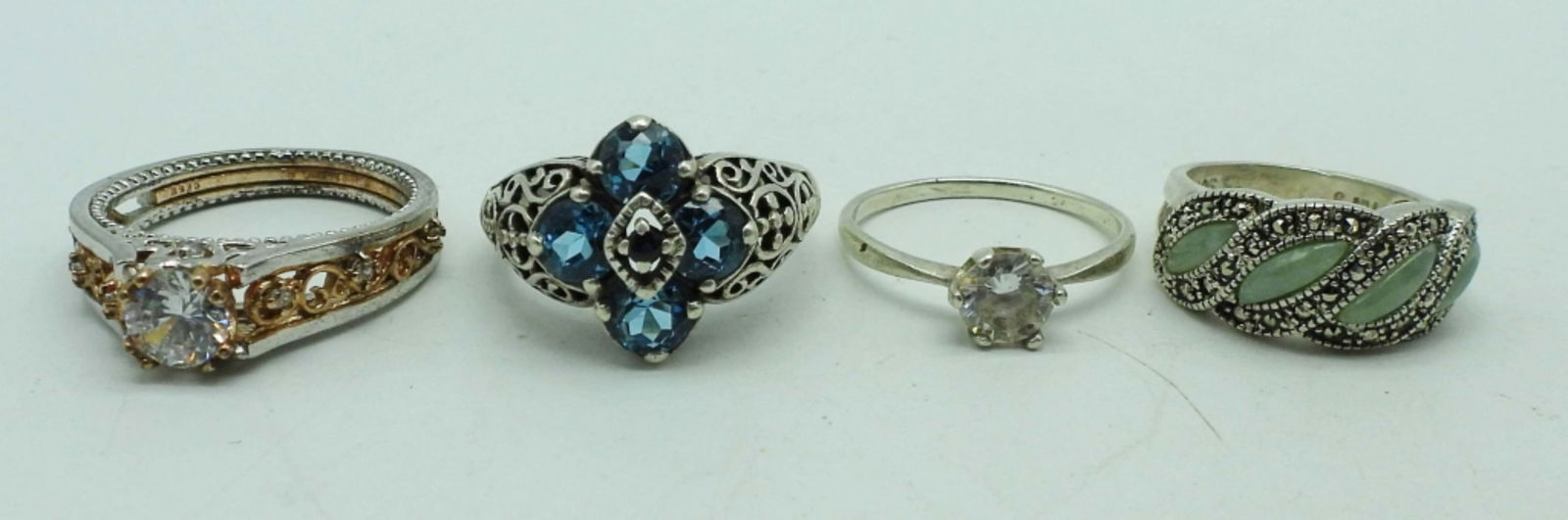 (4) STERLING FASHION RINGS with BLING!: SIZES 5.5 with jadeite, (2) size 7.5 blue stone & clear stone (1) size 9 with copper tone