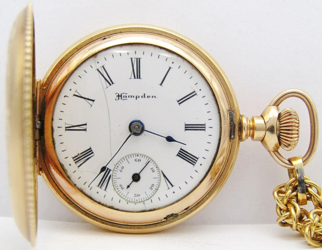 Hampden Molly Stark 7 Jewel, 3/0 Size: Roman Numeral Porcelain Dial; Fancy Hinged Yellow Gold Filled Case; Complete With A 24 Inch Yellow Gold Filled Chain