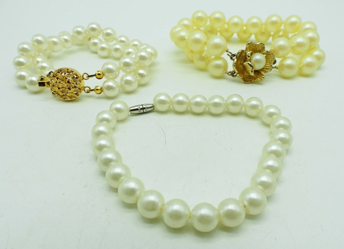 (3) FAUX PEARL BRACELETS: 1-OFF-WHITE DOUBLE STRAND W/FLOWER ON CLASP; 1-DOUBLE STRAND; 1-SINGE STRAND W/BARREL CLASP