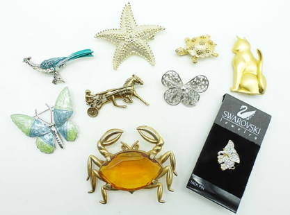 (9) ANIMAL PINS AND BROOCH LOT: 8 OUT OF THE 9 ARE 2IN OR UNDER IN LENGTH, 1 GOLD-TONE AMBER STONE CRAB IS 3IN LONG, 2 SILVER-TONE BUTTERFLIES, 1 HORSE AND RIDER GOLD TONE, 1 GOLD-TONE FLOWER TURTLE, 1 STARFISH, 1 SWAROVSKI