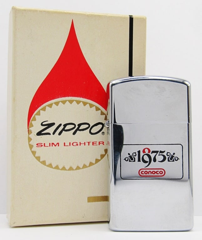 1974 Unfired Slim Advertising Zippo "1975 Conoco": 100 Year 1875-1975 Conoco Advertising Zippo Lighter New In Original Box.