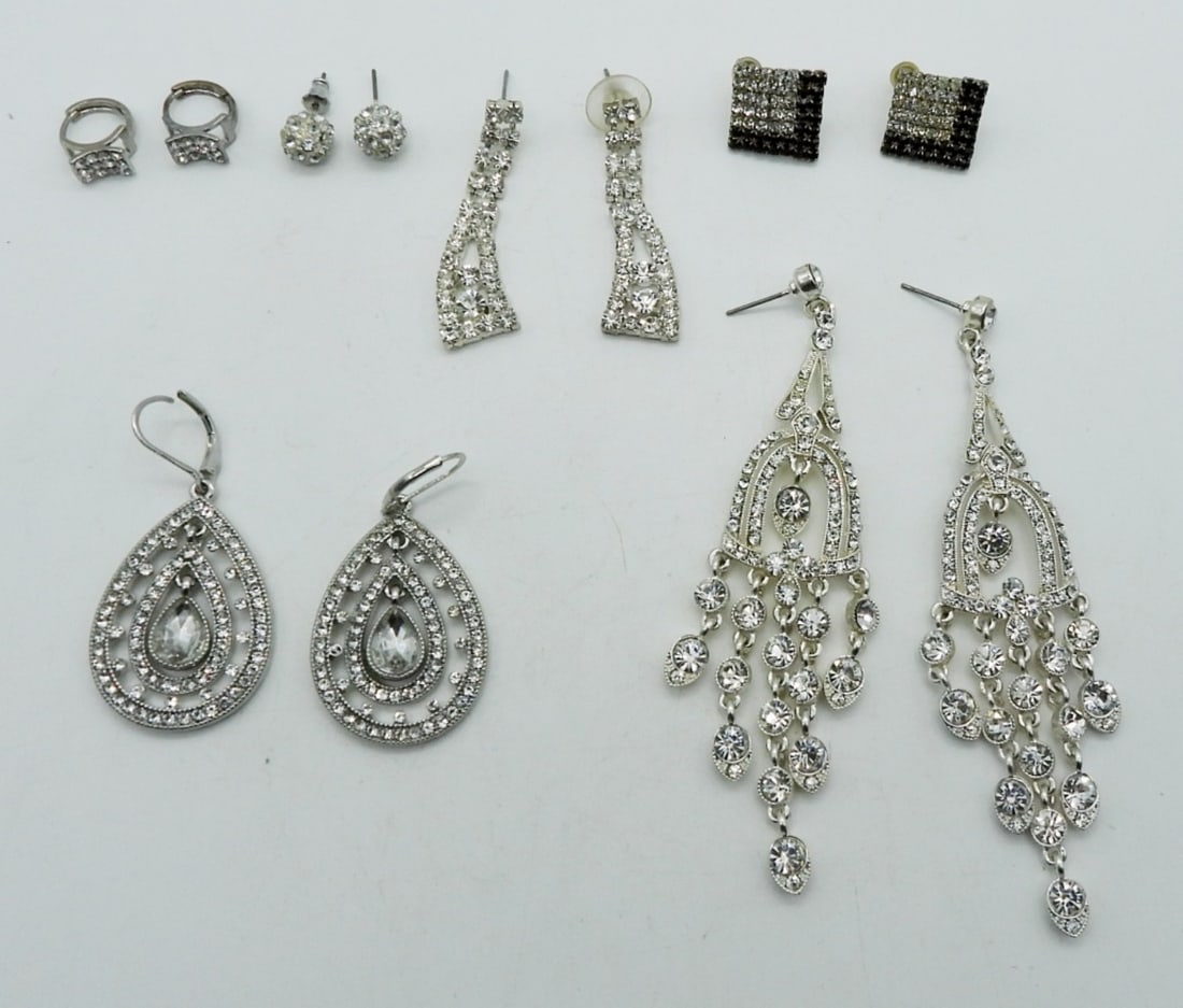 (6) RHINESTONE PIERCED EARRINGS: 3- DANGLED (1 PAIR IS A MONET PAIR),2- STUDS, 1- HUGGIE, EACH PAIR IS ALL CLEAR RHINESTONES, ONE DOES HAVE BLACK RHINESTONES