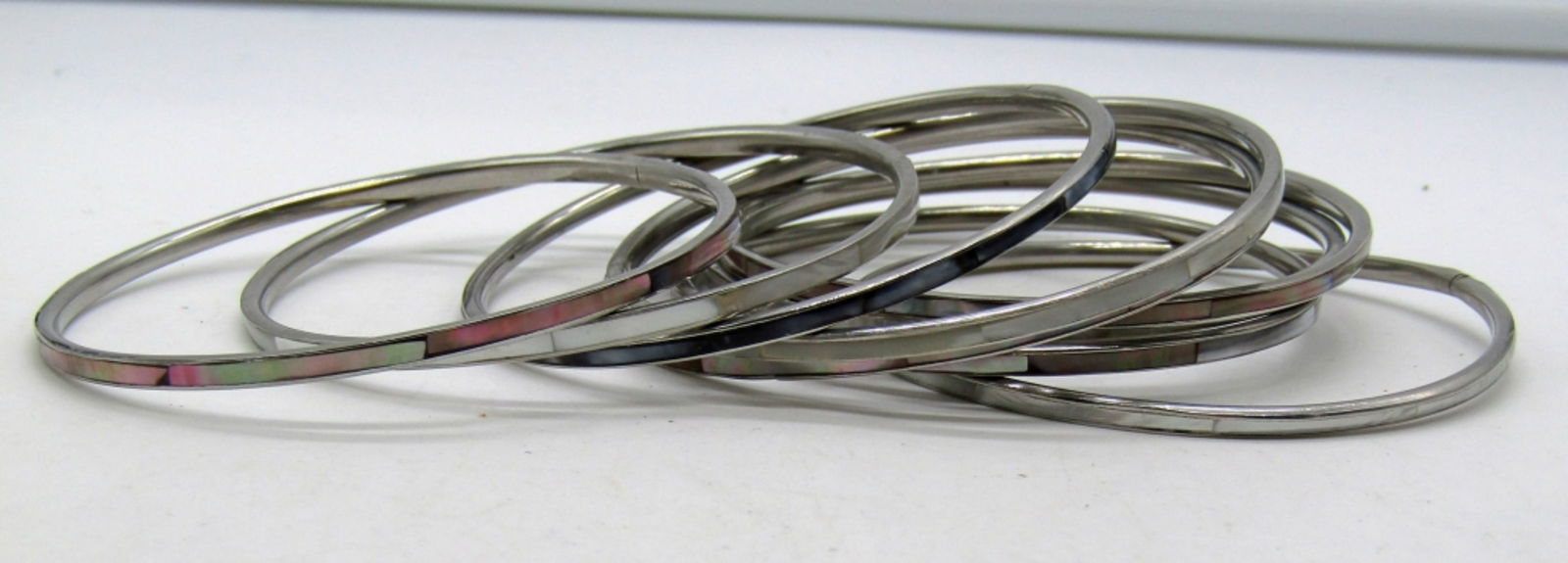 (9) ABALONE INLAY BANGLES: ALL SILVER TONE, ALL ARE 3IN WIDE