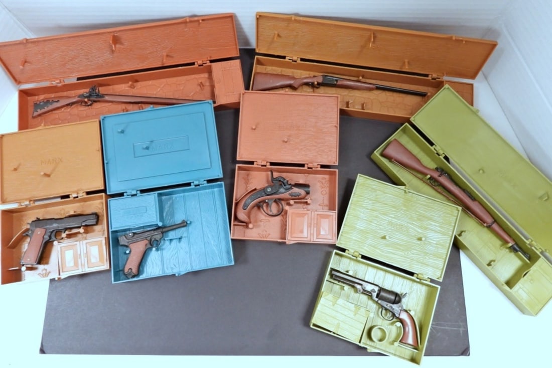 (7) MARX HISTORICAL MINATURE GUN LOT: ALL DIFFERENT - DOUBLE BARREL SHOTGUN, THE KENTUCKY RIFFLE, THE SPRINGFIELD RIFLE 1903, U.S. ARMY .45 AUTOMATIC, 9mm LUGER, STAGECOACH PISTOL, THE DERRINGER - ALL in ORIGINAL PLASTIC MARX CONTAINERS