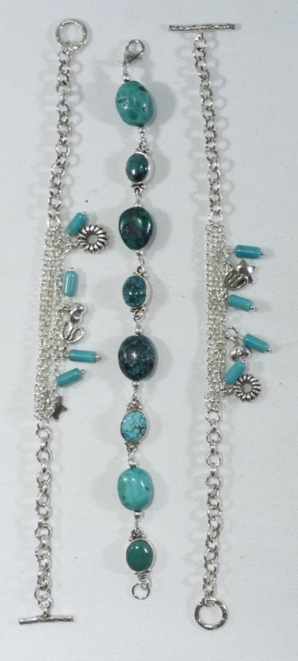 (3) STERLING TURQUOISE CHARM BRACELETS: 26.6 DWT STERLING SILVER BRACELETS WITH TURQUOISE AND DANGLY CHARMS, 7" & 8" CHAINS