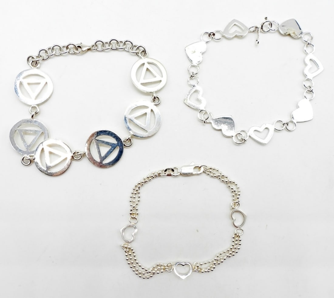 (3)STERLING BRACELET: 15DWT, 1- 7 1/2IN LONG TRIANGLE WITH A LOBSTER CLASP, 1- 7 1/2 LONG HEART WITH SPRING CLASP, 1 6 1/2IN LONG HEART WITH BALL CHAIN WITH LOBSTER CLASP, ALL STAMPED 925 ON THE CLASP