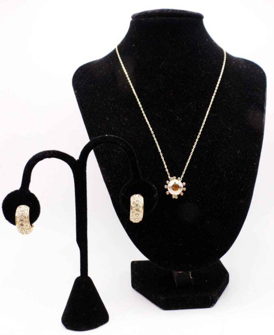 SWAROVSKI NECKLACE AND EARRING SET: 17IN LONG, GOLD TONE, LOBSTER CLASP ADJUSTABLE, YELLOW STONE WITH TINY CLEAR STONES AROUND, STAMPED WITH MAKER MARK, CLIP-ON EARRINGS STAMPED WITH SWAROVSKI ON CLIP