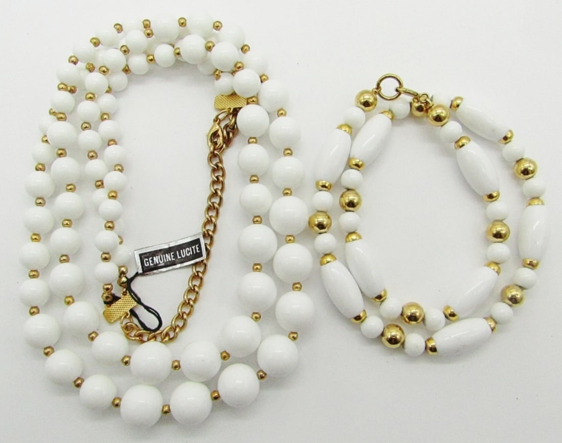 (2) WHITE & GOLD TONE BEADED NECKLACES: DIFFERENT DESIGNS, (1) 16" LONG, (1) 24" LUCITE DOUBLE STRAND