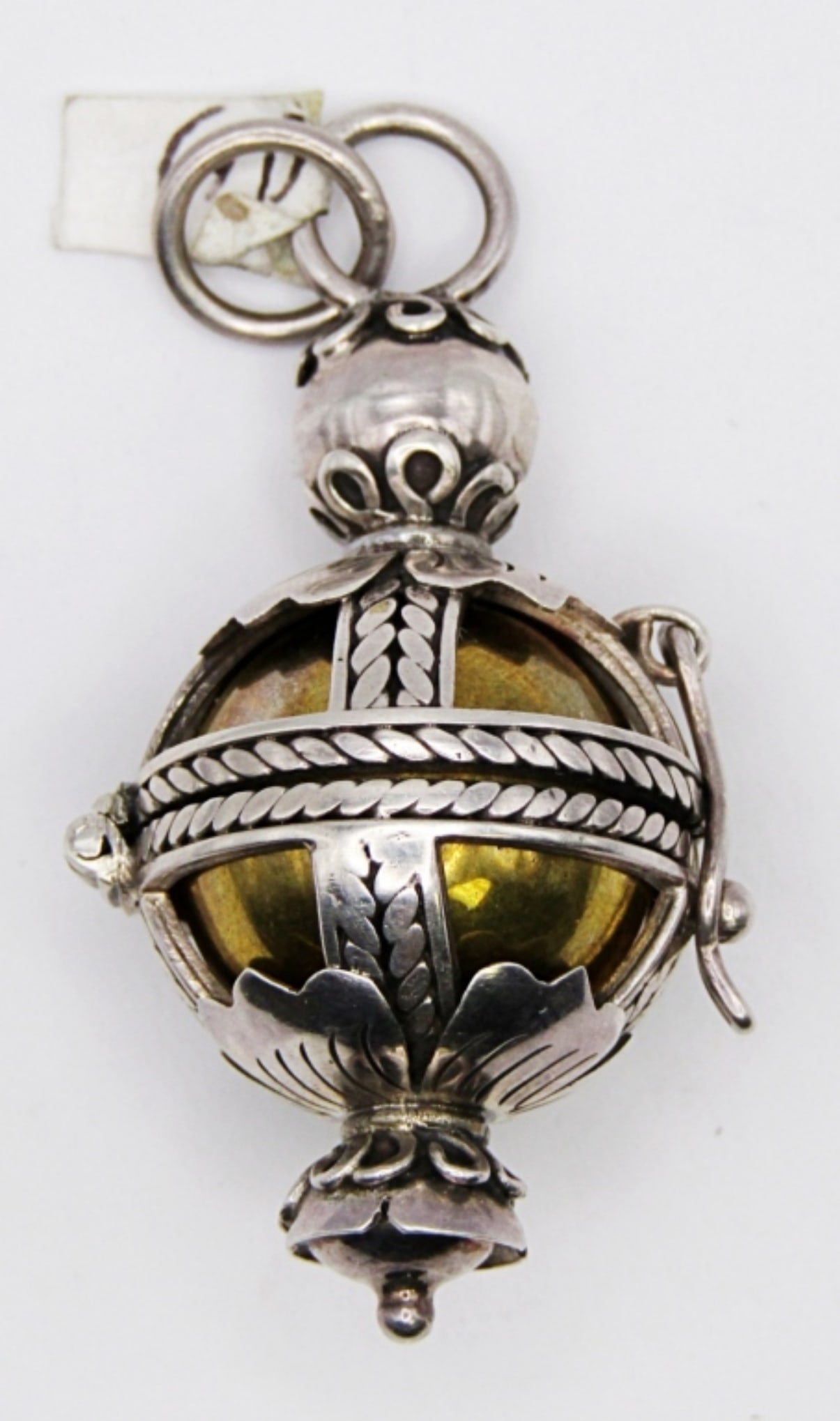 UNQUIE STERLING PENDANT: 15.6DWT,2IN LONG, PENDANT OPENS AND HAS A GOLD PLATED STERLING BALL INSIDE, STAMPED 925 ON THE INSIDE