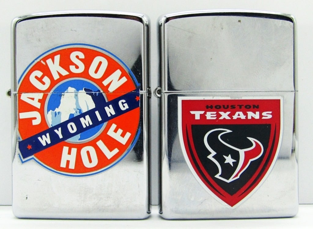 (2) 2005 Zippo Lighters; Jackson Hole & Texans: Jackson Hole Wyoming & Houston Texans; Both Lightly Used Conditions.