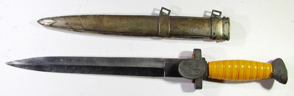World War II German Red Cross Officer's Dagger: With Scabbard; "Carl Julius Krebs Solingen" Stamp on back of Blade; Hilt is loose, with the grip & guard being loose/broken (photographed). Used Condition. 15" Overall Length.