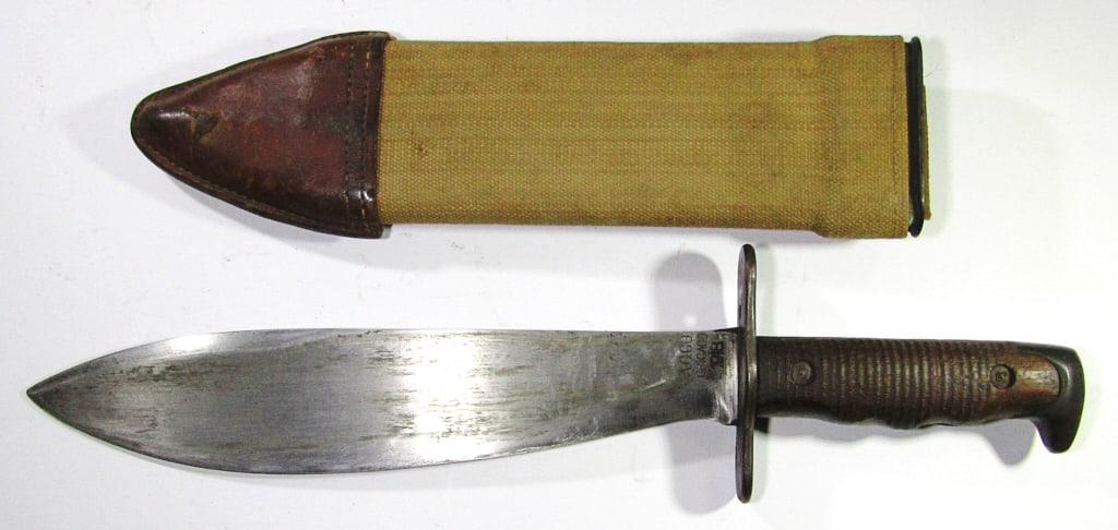 WWI US Model 1917/1918 Plumb Phila Bolo Knife: With Scabbard; Model U.S. MOD 1917 C.T.; Dated A.C.Co. Chicago 1918; 15" Overall Length, 10.25" Blade; Scabbard Marked A-K-Co. 1918 R.H.S."; Used Condition.