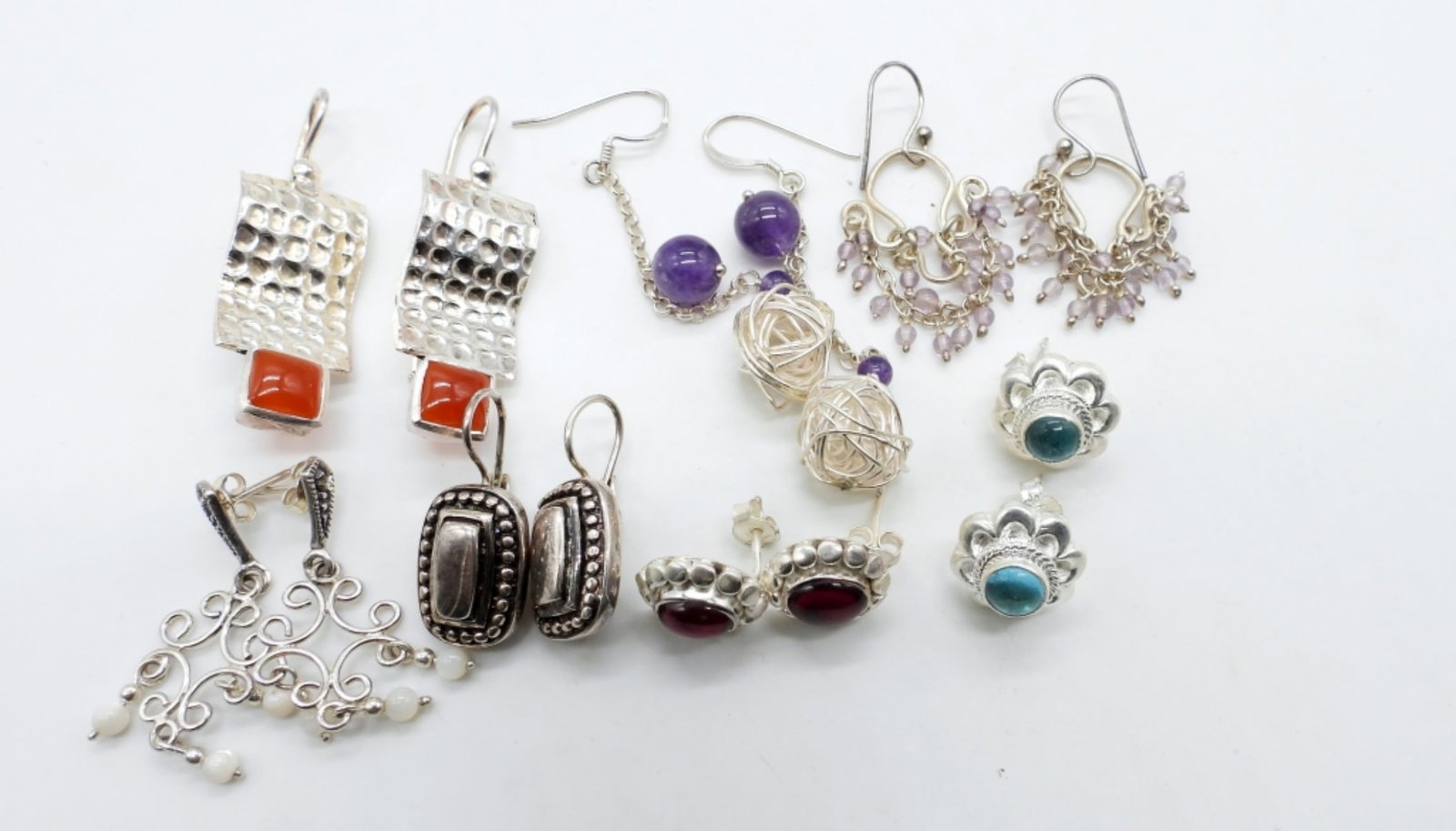 (7) STERLING EARRINGS: 26 DWT, ALL STAMPED 925 ON THE BACKS, PIERCED, 2- STUDS, 2- DROP STYLE, 3-DANGLES