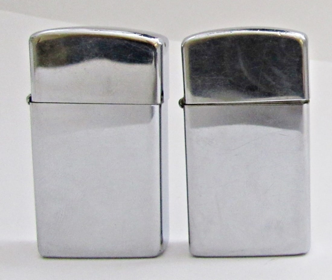 (2) VINTAGE 1970'S SLIM STYLE ZIPPOS: 1970 & 1974 SLIM STYLE SILVER TONE ZIPPOS; USED NICE OVERALL CONDITION