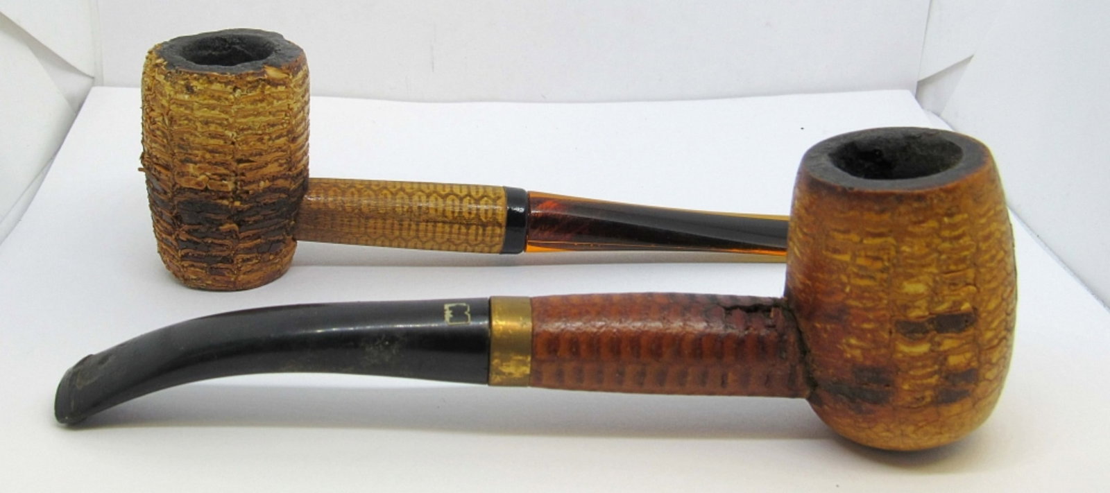 PAIR OF ANTIQUE COBB PIPES: ONE MISSOURI ORIGINAL MEERSCHAUM COBB PIPE, AND ONE UNMARKED COBB PIPE. PRE-OWNED AND IN AVERAGE CONDITION.