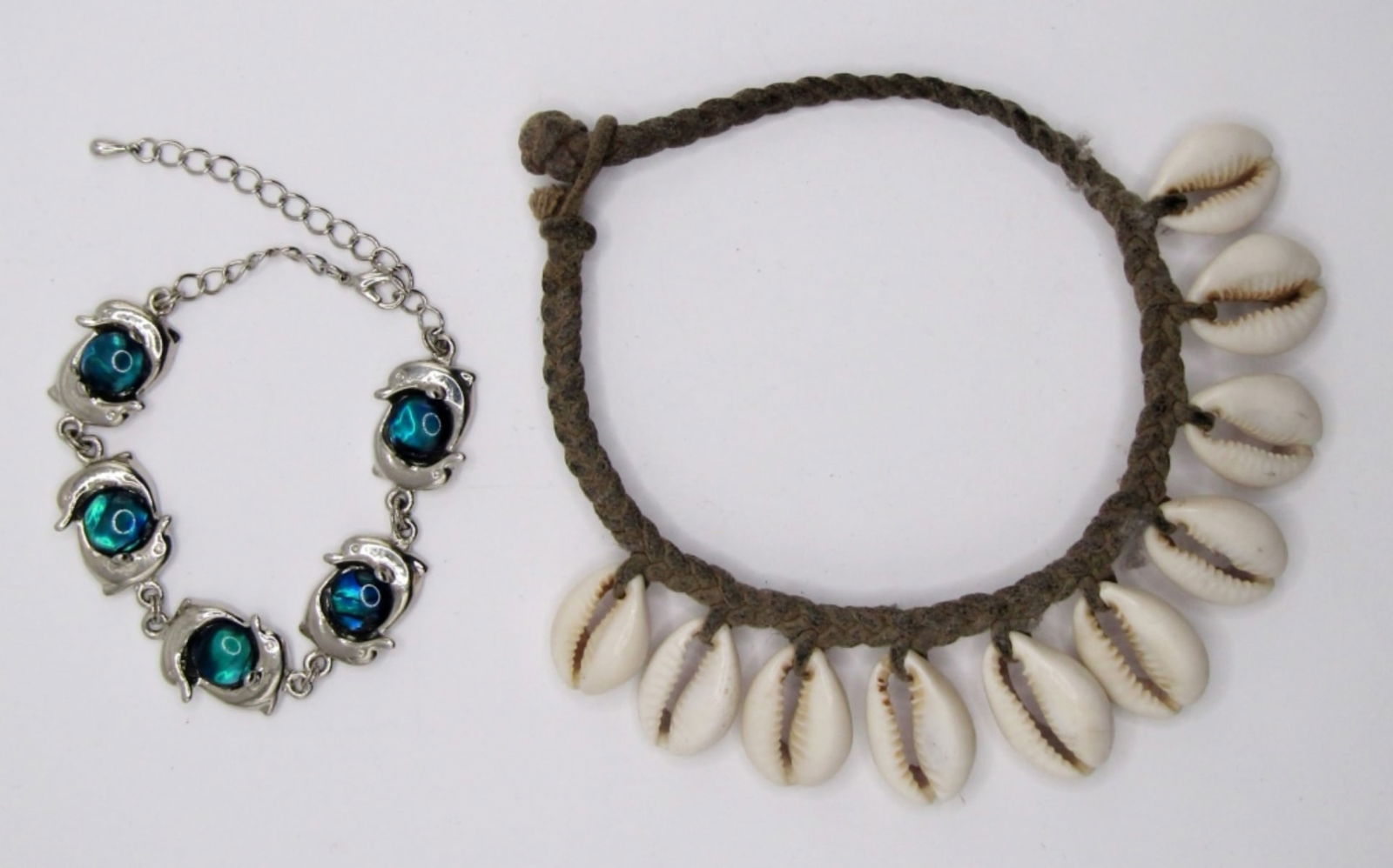 ANKLET AND BRACELET: 1-FABRIC WITH SHELLS ANKLET; 1- DOLPHIN BRACELET WITH BLUE/GREEN STONES