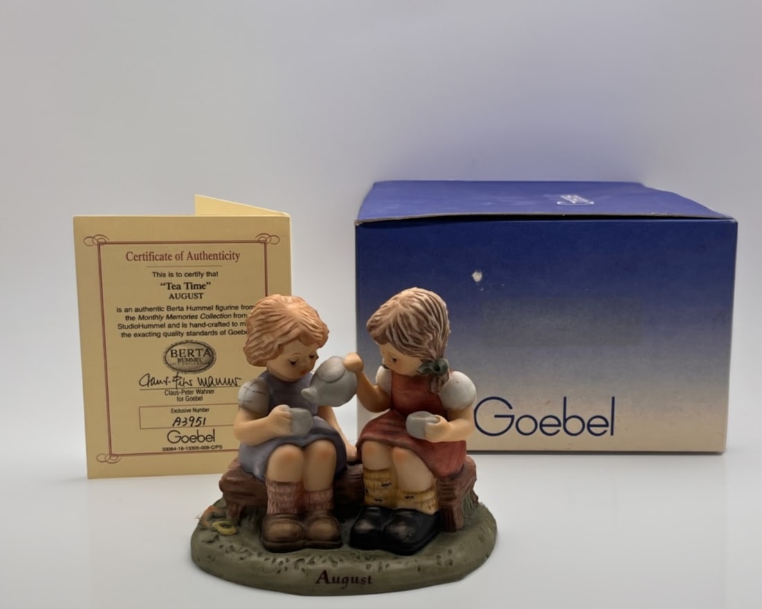StudioHummel "Tea Time (August)": Goebel StudioHummel from the Monthly Memories Collection. "Tea Time (August)" BH121/2/0. Original Box and COA, and has the Exclusive Number of A3951 3"