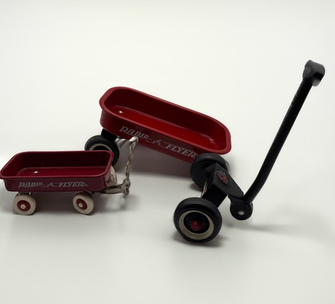 (2) Radio Flyer Little Wagon Toy: Wagon #1 still assembled 6.5"L x 1.5"H , Wagon #2 Front wheels are detached from wagon but is fixable. 13" L x3" H