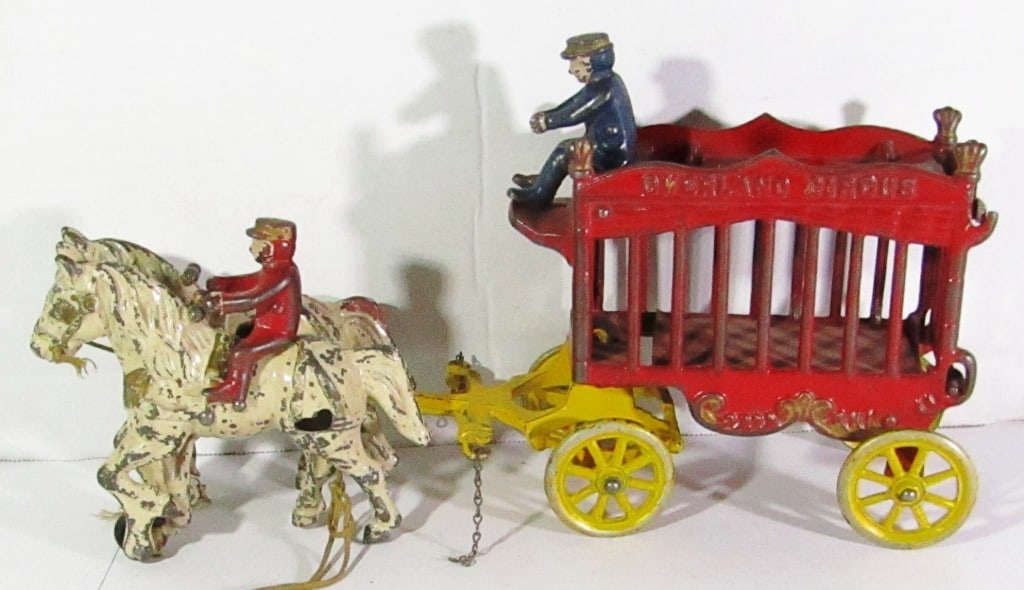 Antique Cast Iron Overland Circus Wagon & Horses: Used Conditions. Includes Bear Cage, 2 Attached Horses, 2 Conductors. (Wheel on Horse is missing)