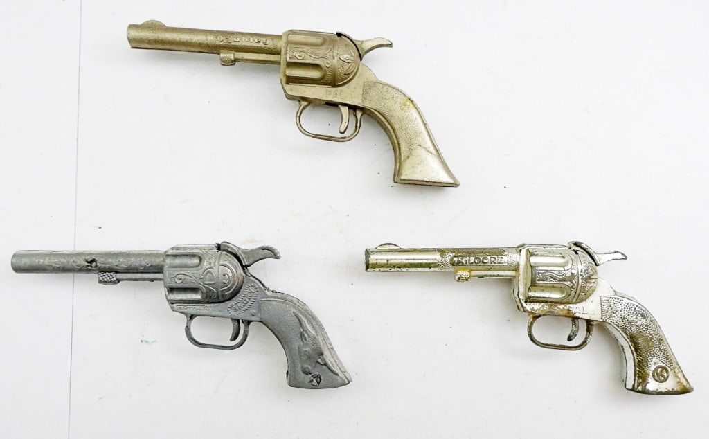 (3) COWBOY CAP GUNS HUBLEY & SMOKEY: ALL NEAR 5 1/2IN LONG, 1 KILGORE PAL, 1-HUBLEY PAL, 1- SMOKEY, ALL PULL BACK AND CLICK