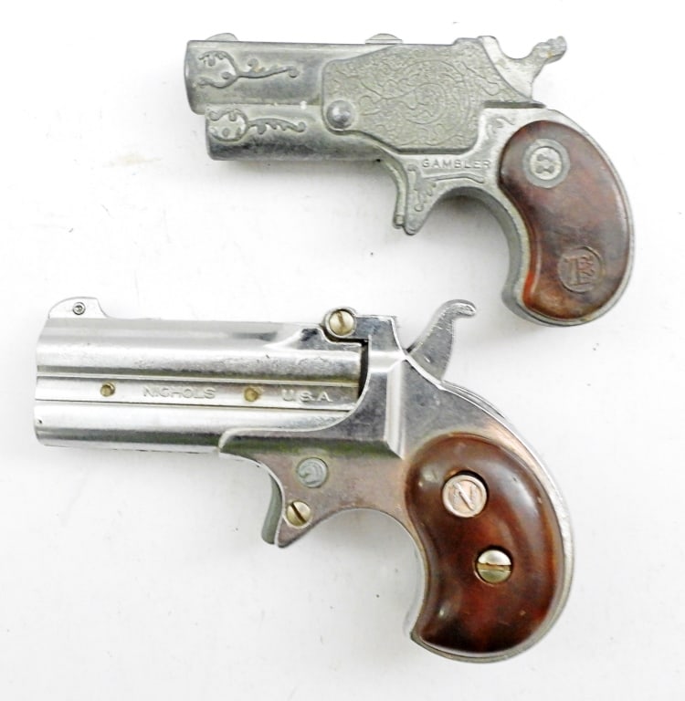 (2) MINI DERRINGER CAP GUNS: 1-4IN LONG, NICHOLS DERRINGER, PULLS AND CLICKS, SIDE IS CHIPPED, 1 GAMBLER, PULLS AND CLICKS