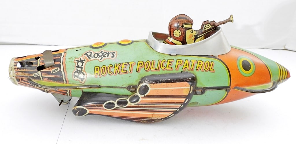 MARX & CO. BUCK ROGERS ROCKET POLICE PATROL: FOR REPAIR, WHEELS MOVE WIND UP DOES NOT WORK, 12IN LONG