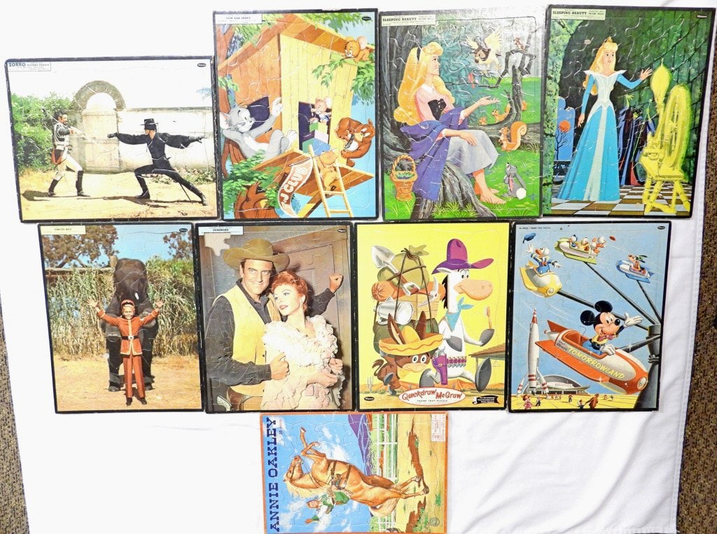 (8) VINTAGE WHITMAN CHILDRENS PUZZLES: 14X1 IN SIZE, SOME ARE STARTING TO SEPARATE, 1 WALT DISNEY TOMORROWLAND, 1 QUICKDRAW McGRAW,1 TOM AND JERRY, 1 GUNSMOKE (MISSING ONE PIECE), 1 CIRCUS BOY, 1 ZORRO, 2 SLEEPING BEAUTY, 1- MILTON BRADLEY